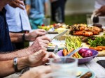 closeup-of-diverse-people-enjoying-barbecue-party-together